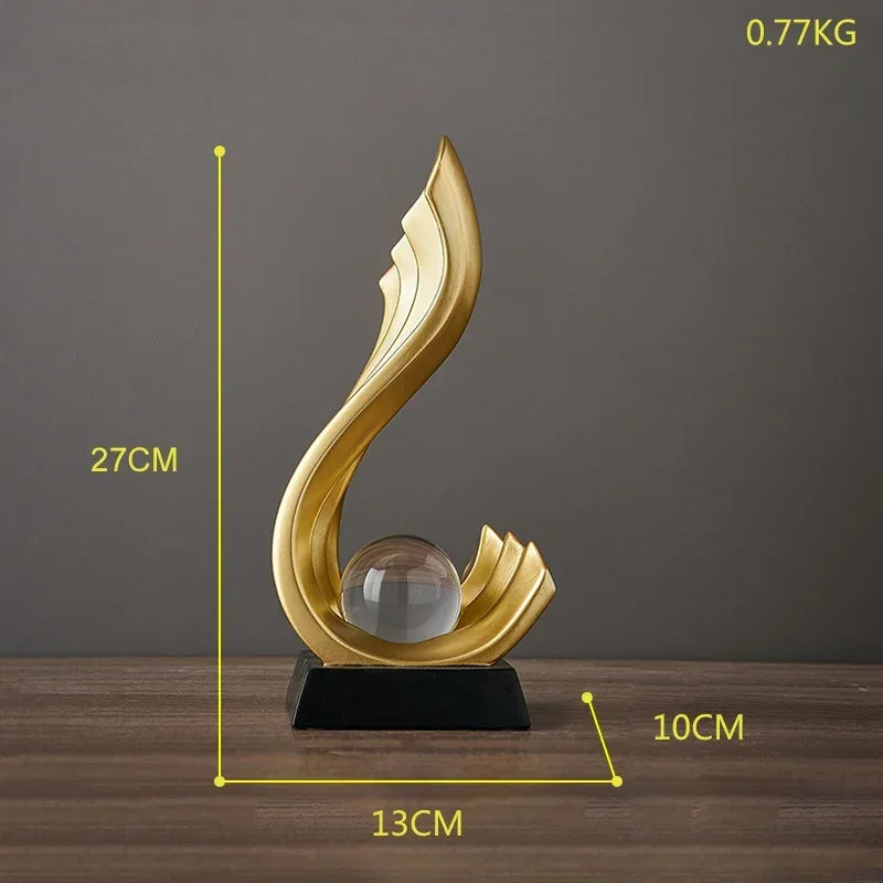 escultura bola de cristal metal dourado 15x10x10cm